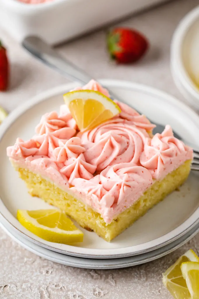 Top down view of strawberry frosting on a cake.