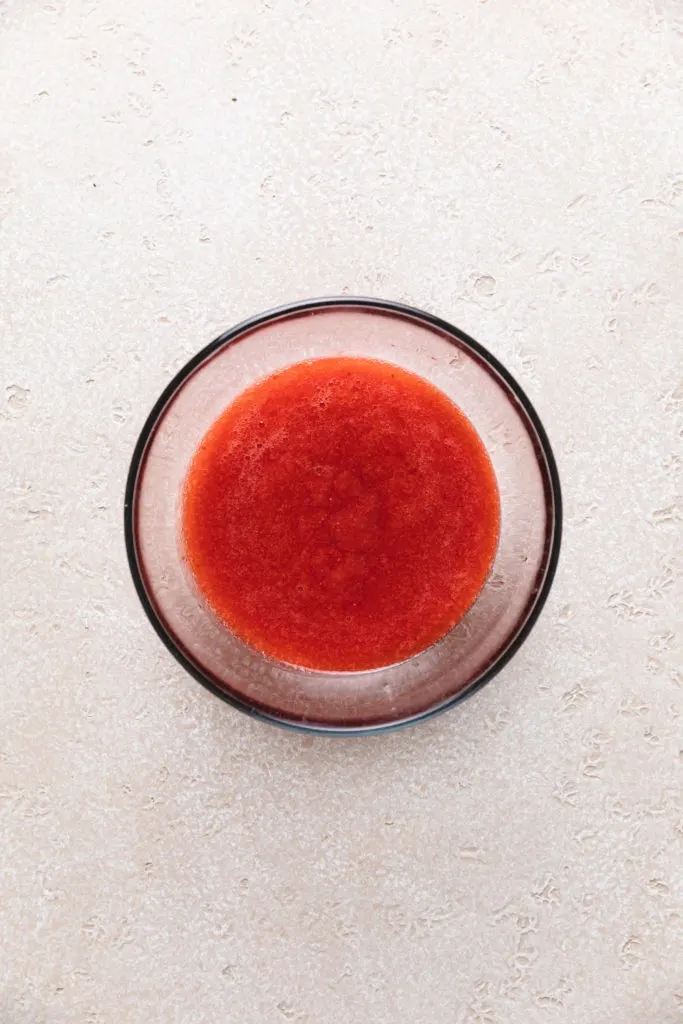 Bowl of pureed strawberries.