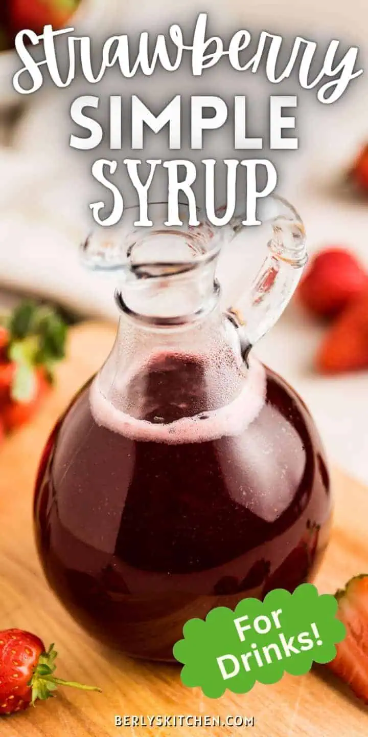 Strawberry simple syrup sitting on a board.