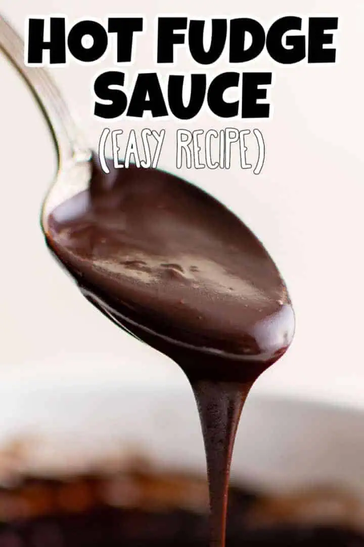 Spoon dripping chocolate fudge topping.