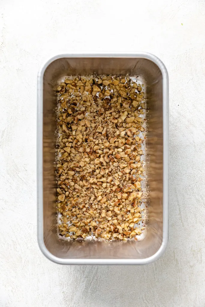 Nuts in the bottom of a loaf pan.