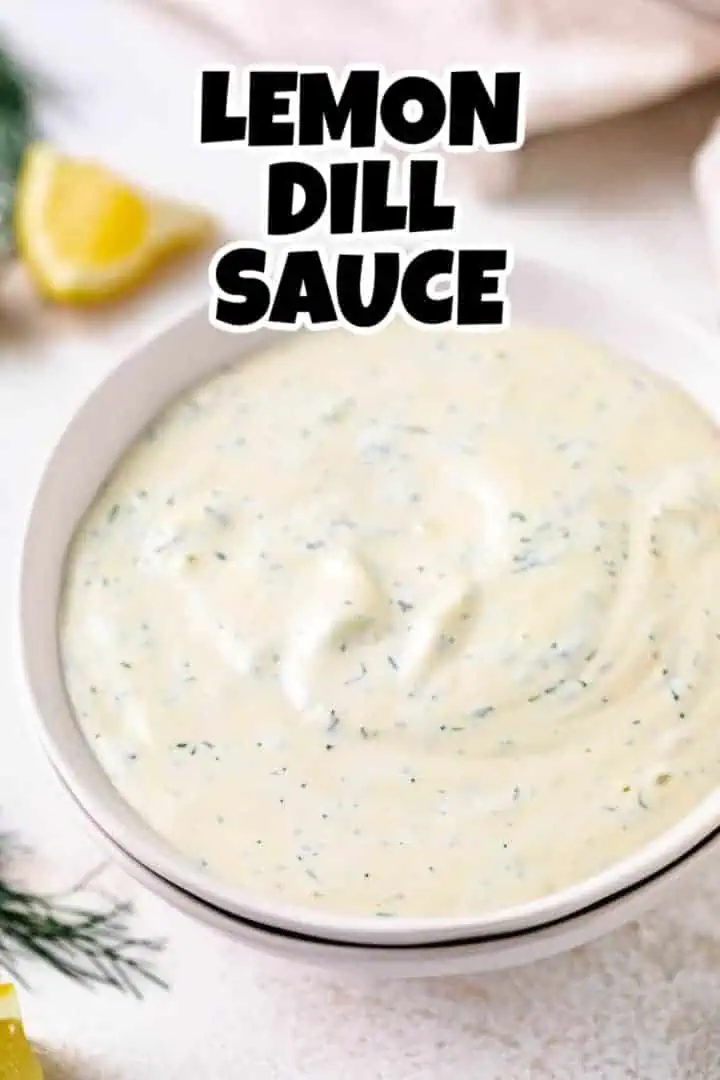 Close up view of a gray bowl filled with dill sauce.