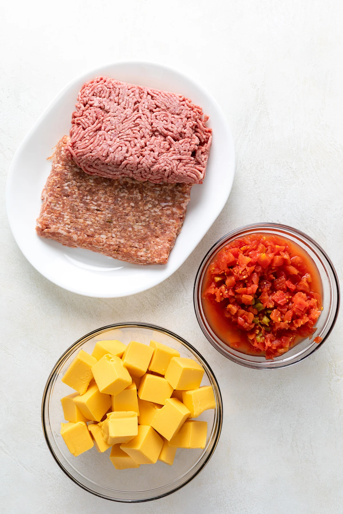 Ingredients used for rotel dip with beef and sausage.