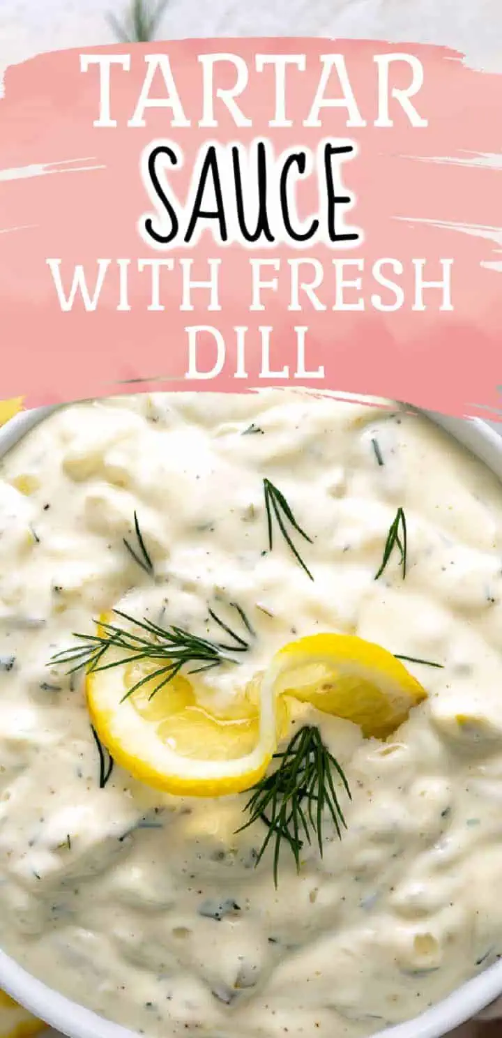 Top down view of a bowl of tartar sauce with lemon.