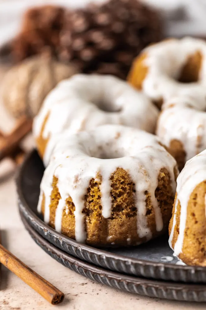 Mini bundt cakes on metal plates.