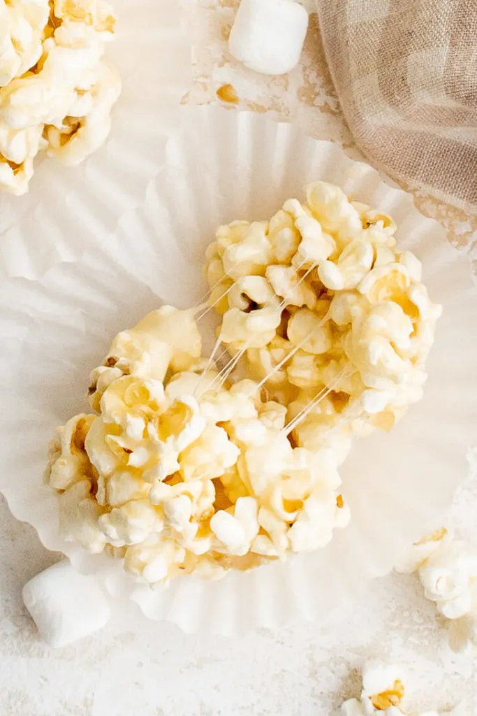 Marshmallow popcorn ball pulled in half.