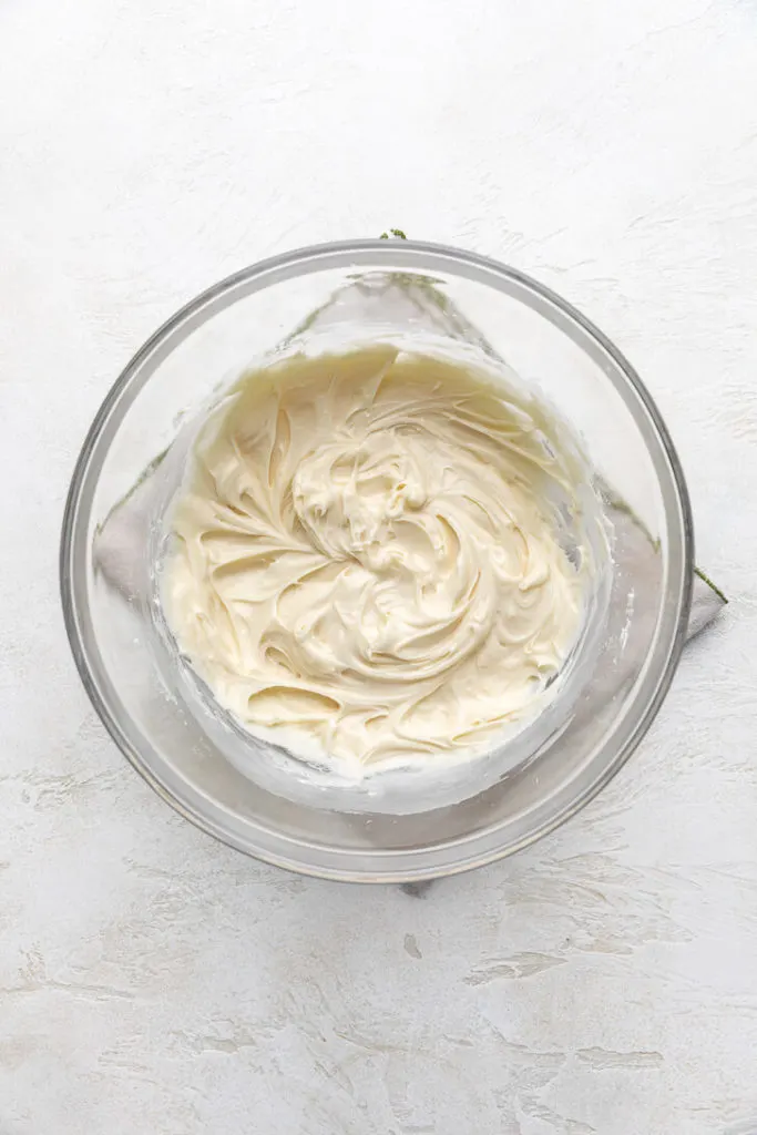 Cream cheese frosting in a bowl.