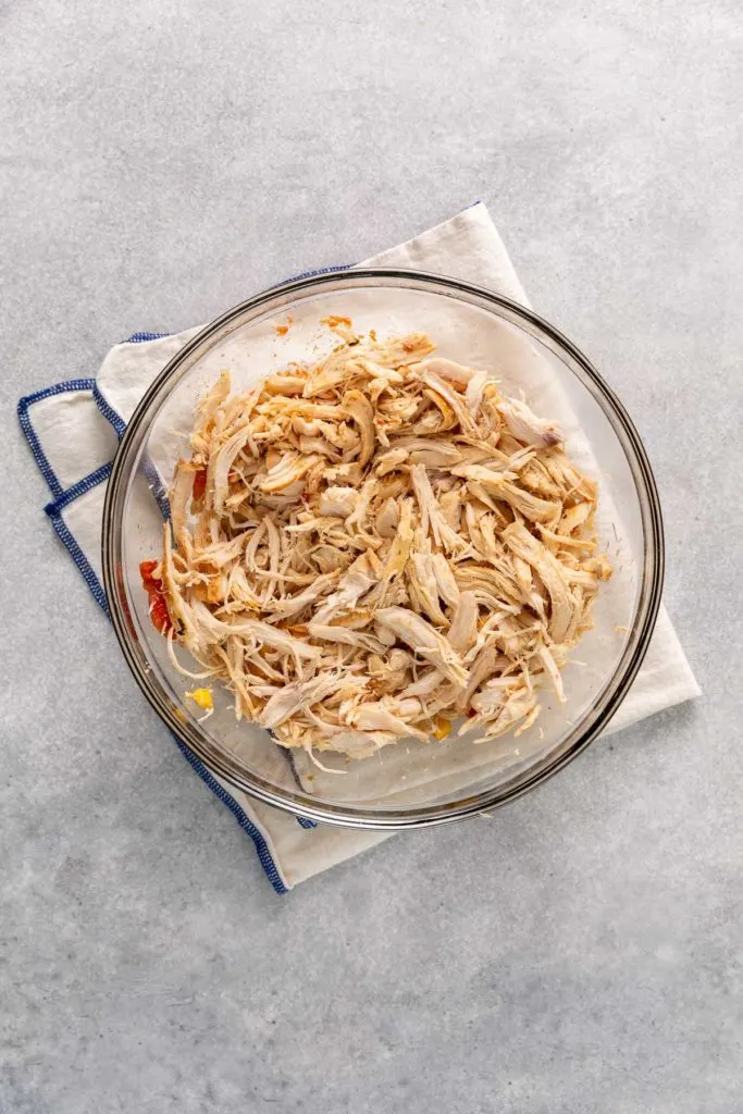 Shredded chicken in a bowl.