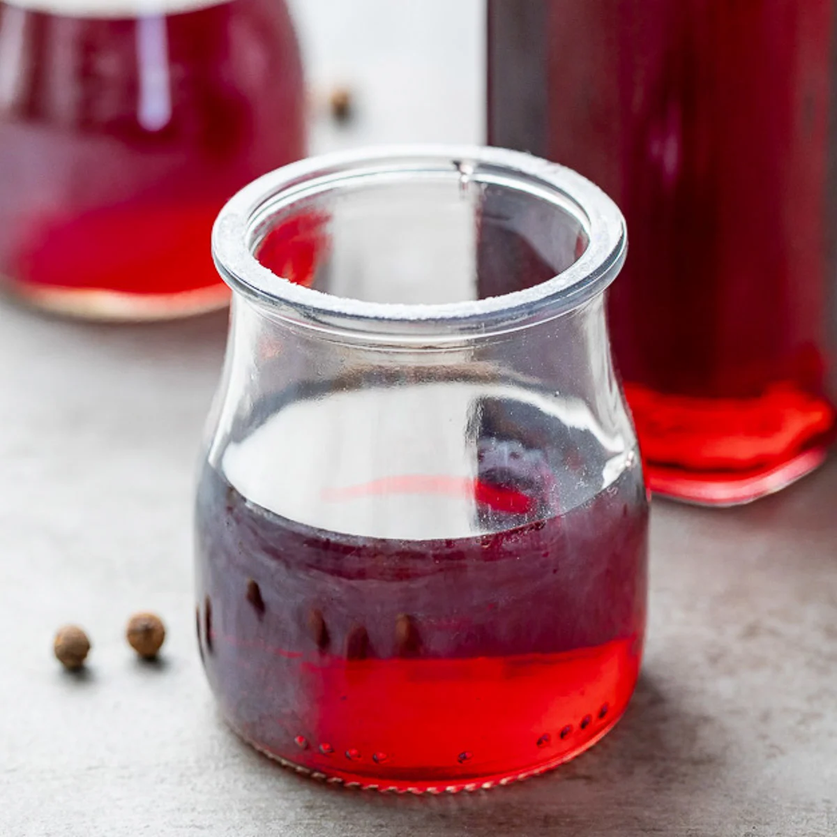 Jars filled with fruity simple syrup.