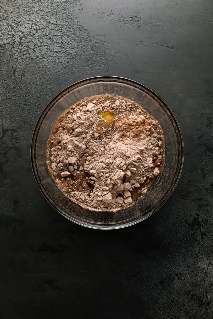 Ingredients for chocolate cake batter in a bowl.