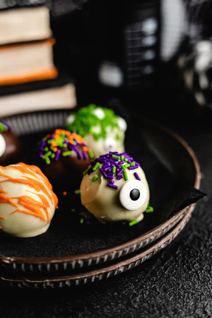 Halloween truffle with purple and green hair.