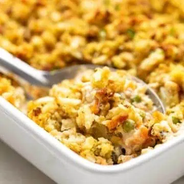 Close up view of casserole being scooped with a spoon.