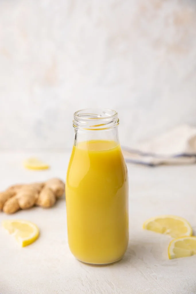 Glass jar filled with spicy ginger syrup.