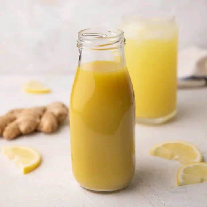 Ginger syrup in a tall jar.