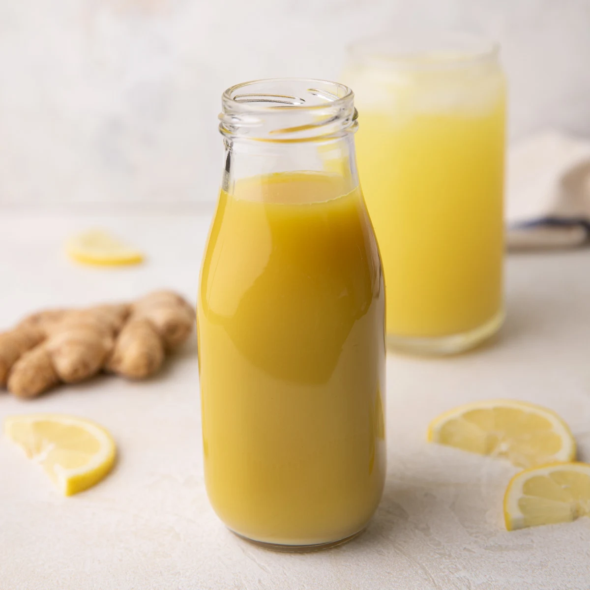 Ginger syrup in a tall jar.