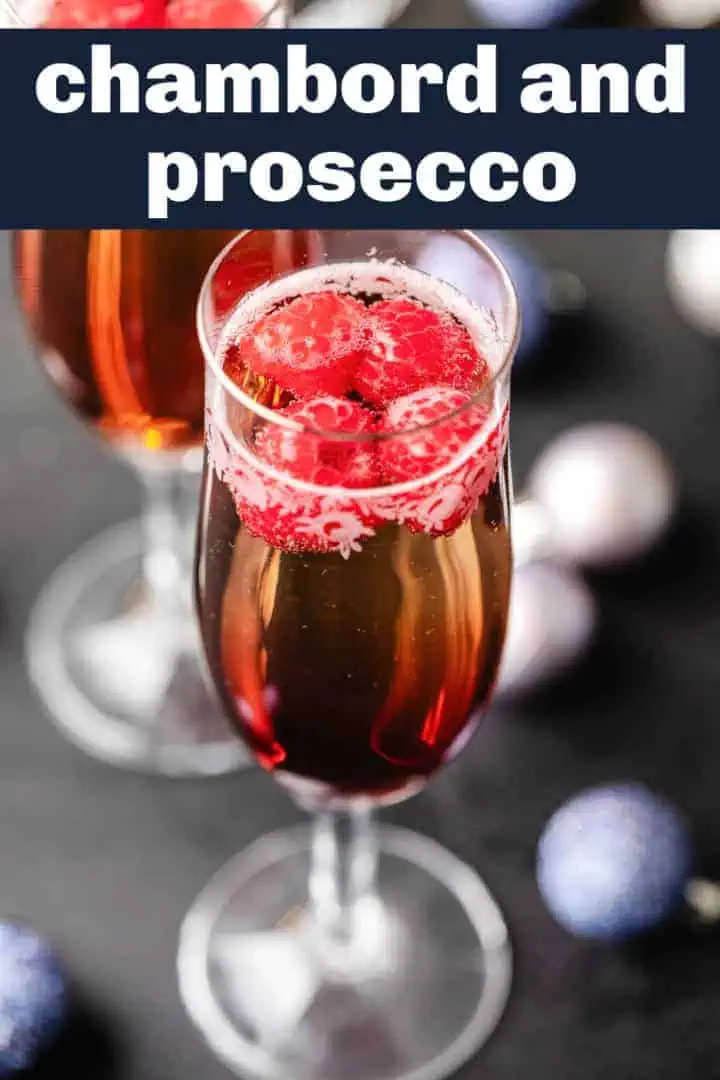 Raspberries in a glass of liqueur and prosecco.