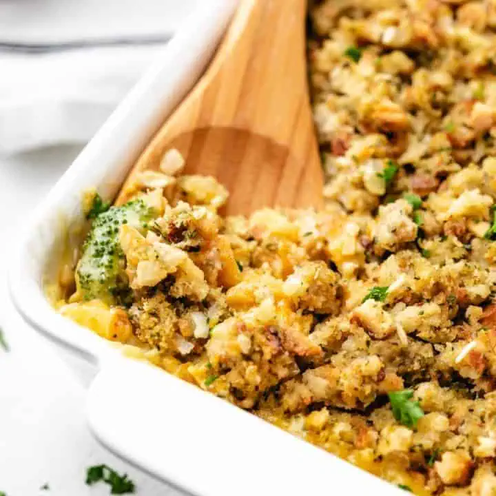 White pan filled with chicken and broccoli stuffing casserole.