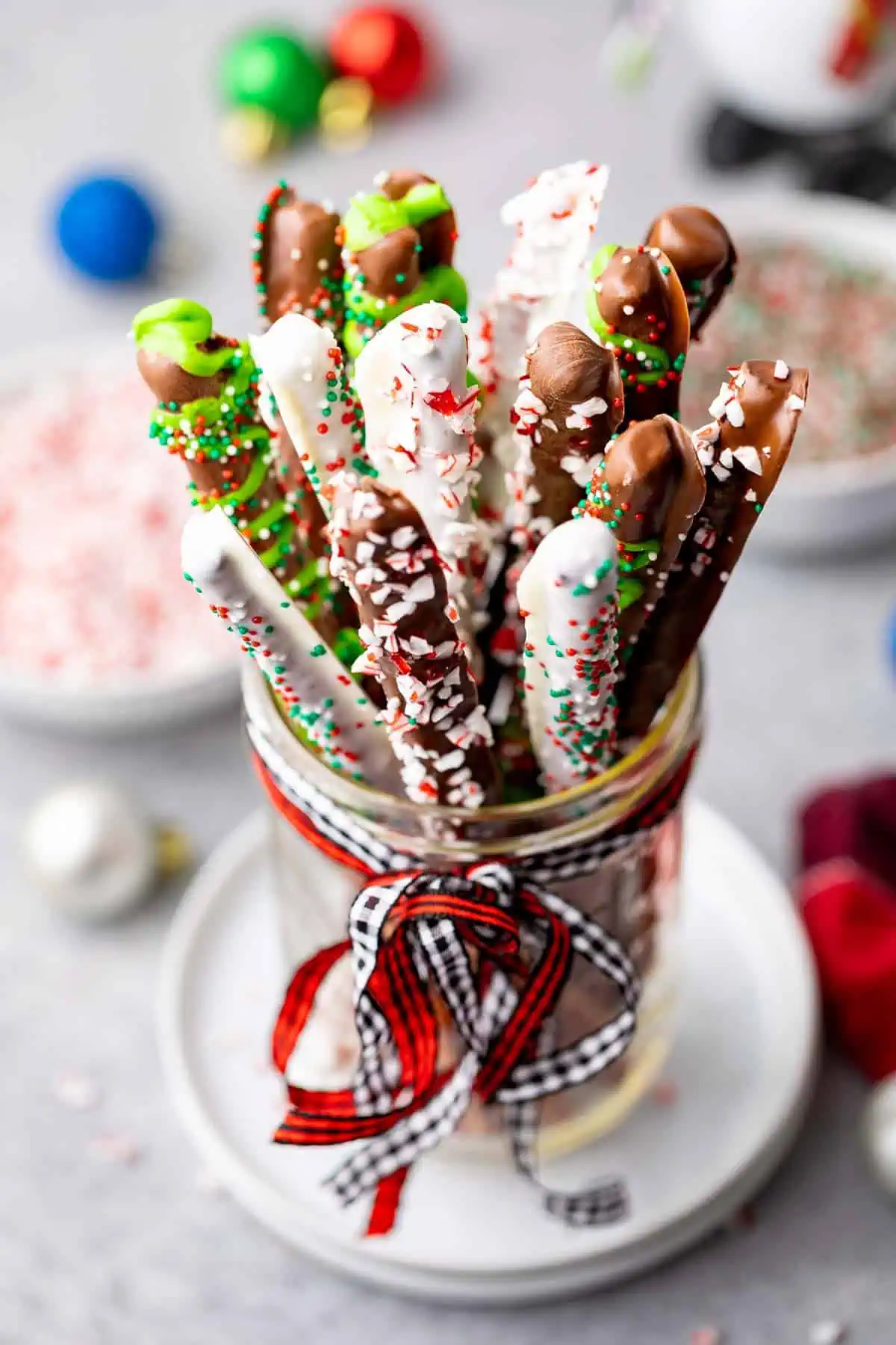 Dipped pretzels in a glass jar.