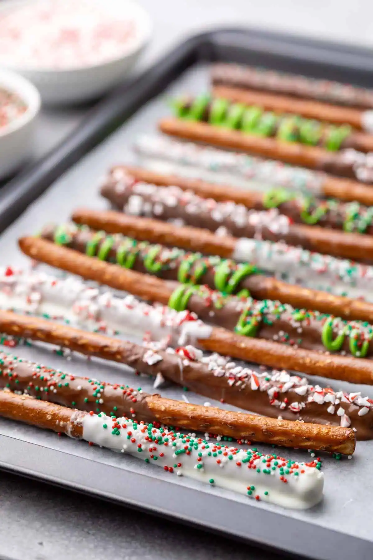 Dipped pretzels on baking sheet.