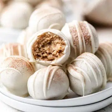 Plate of truffles with cinnamon and sugar.