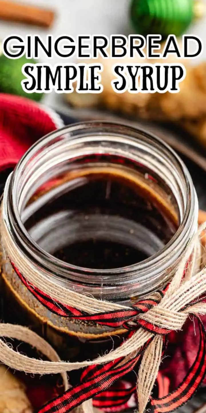 Flavored syrup in a small jar with ribbons.