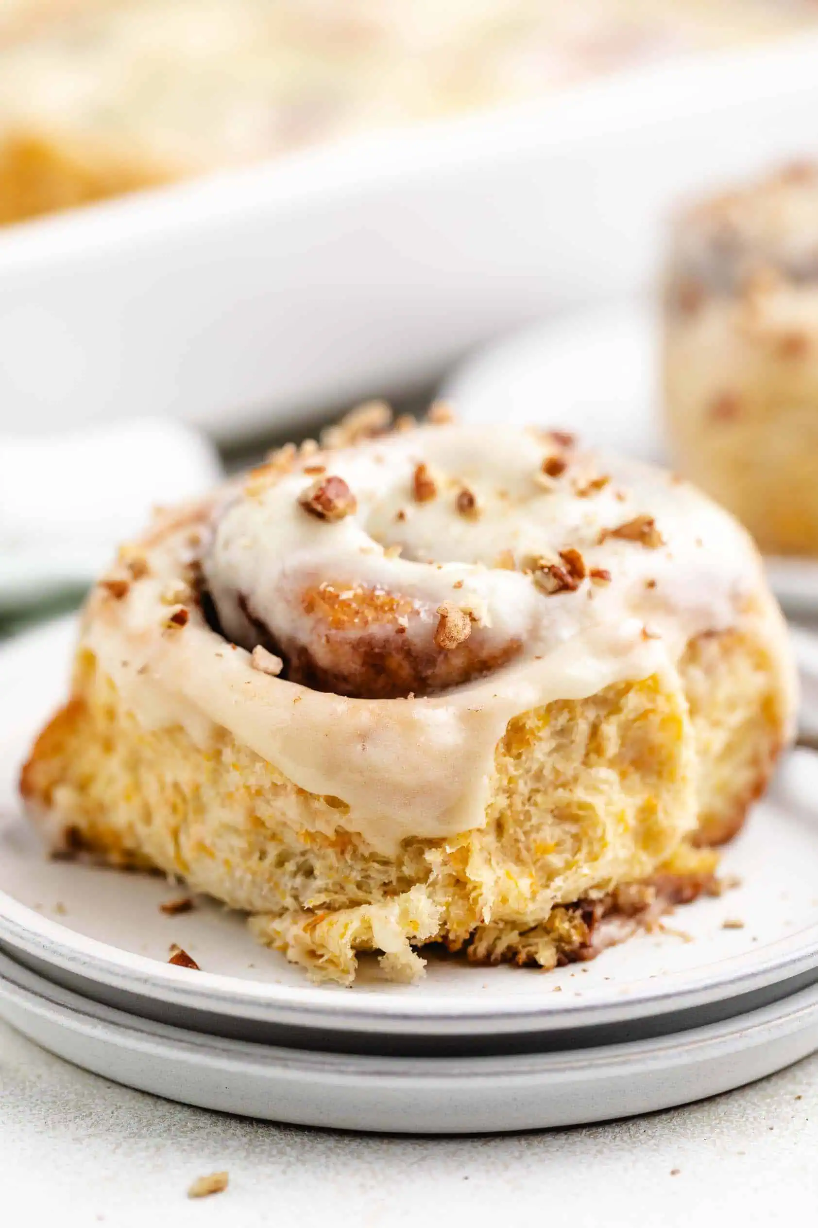 Carrot cake sweet roll on a plate.