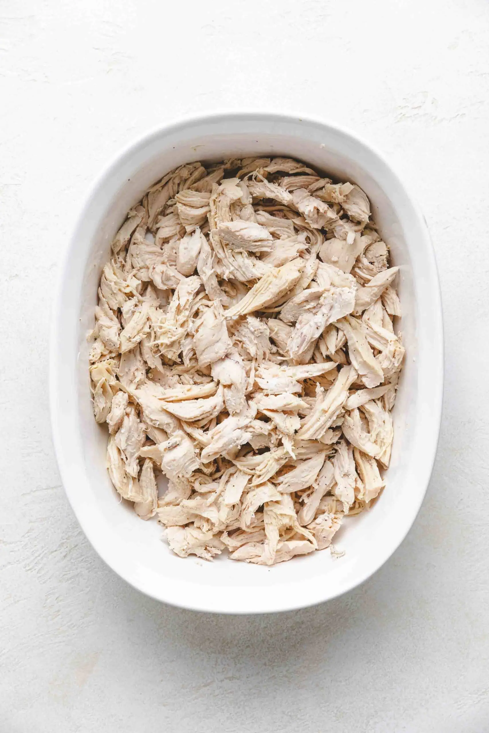 Shredded chicken in a dish.