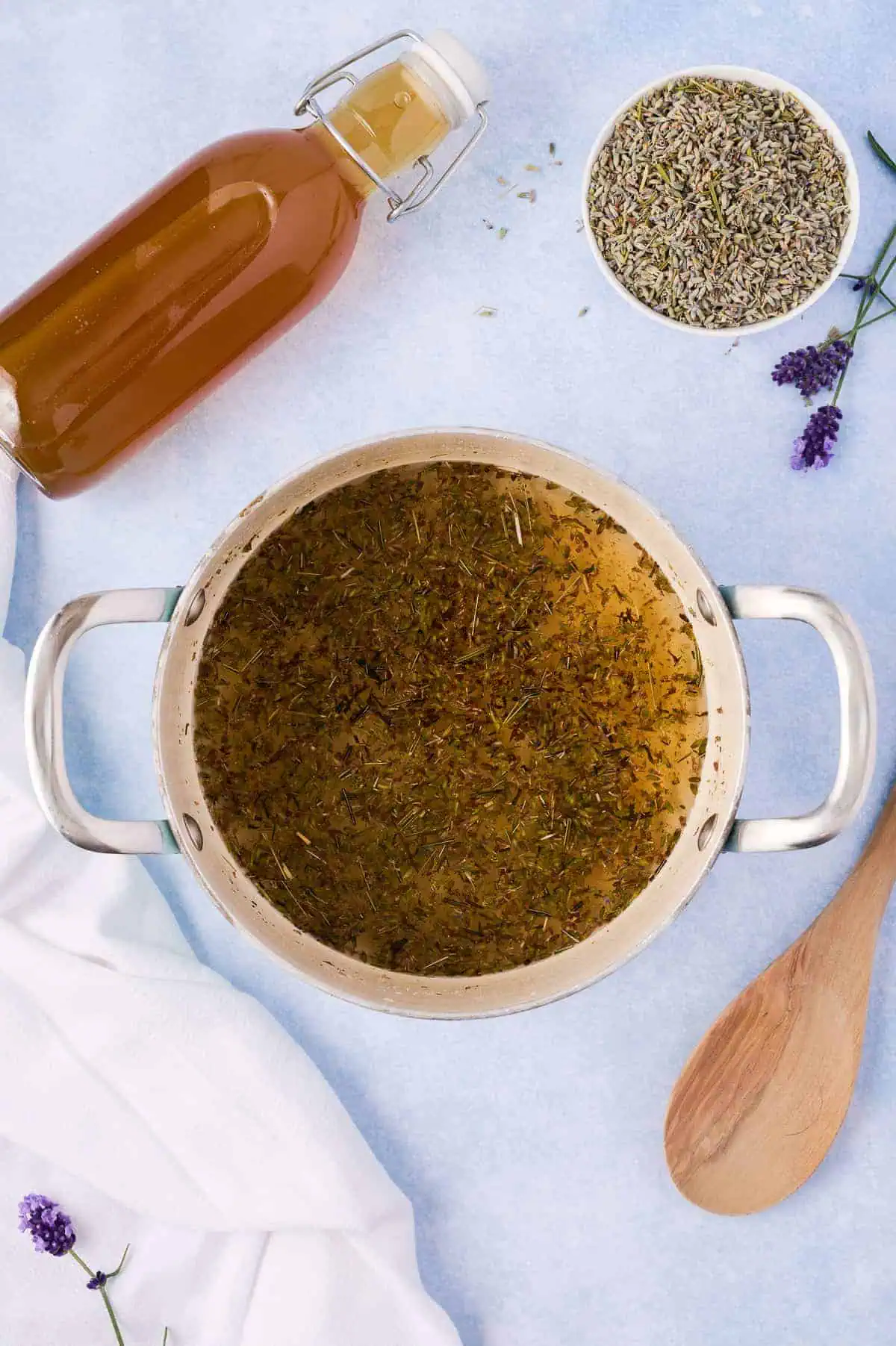 Lavender, sugar and water in a pan.