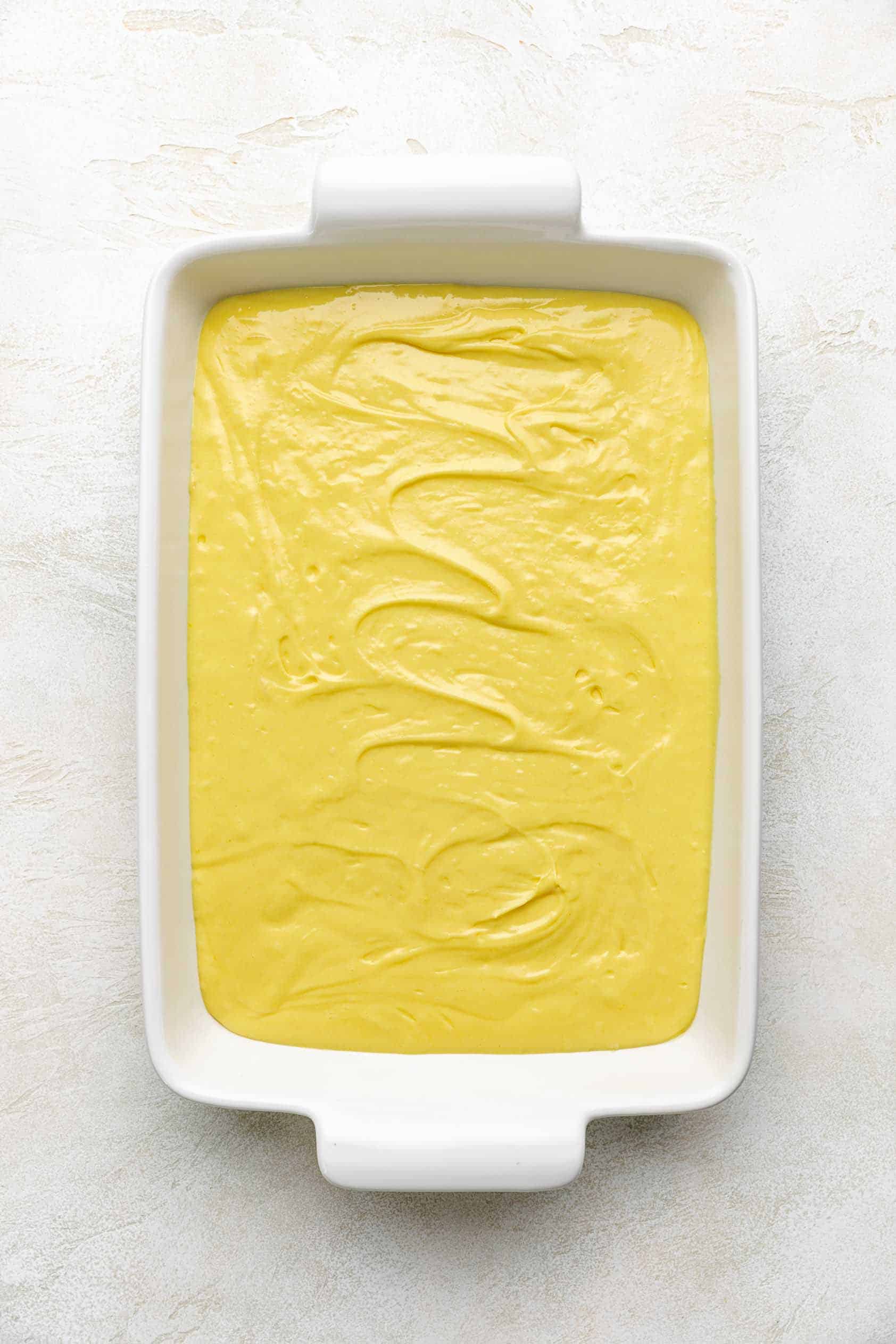 Lemon cake batter in a pan.
