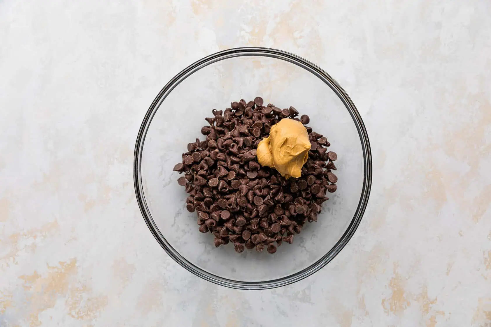 Chocolate chips and peanut butter in a bowl.