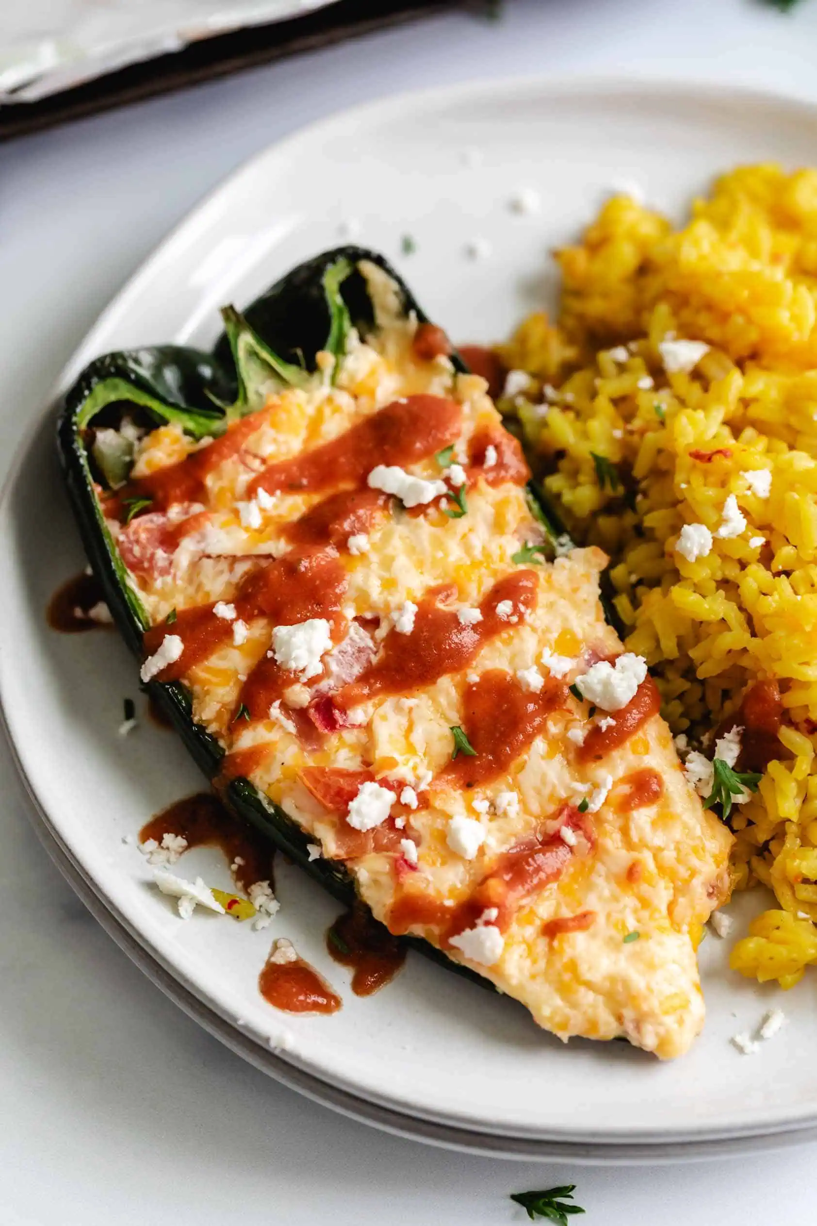 Tomato sauce drizzled over a stuffed pepper.