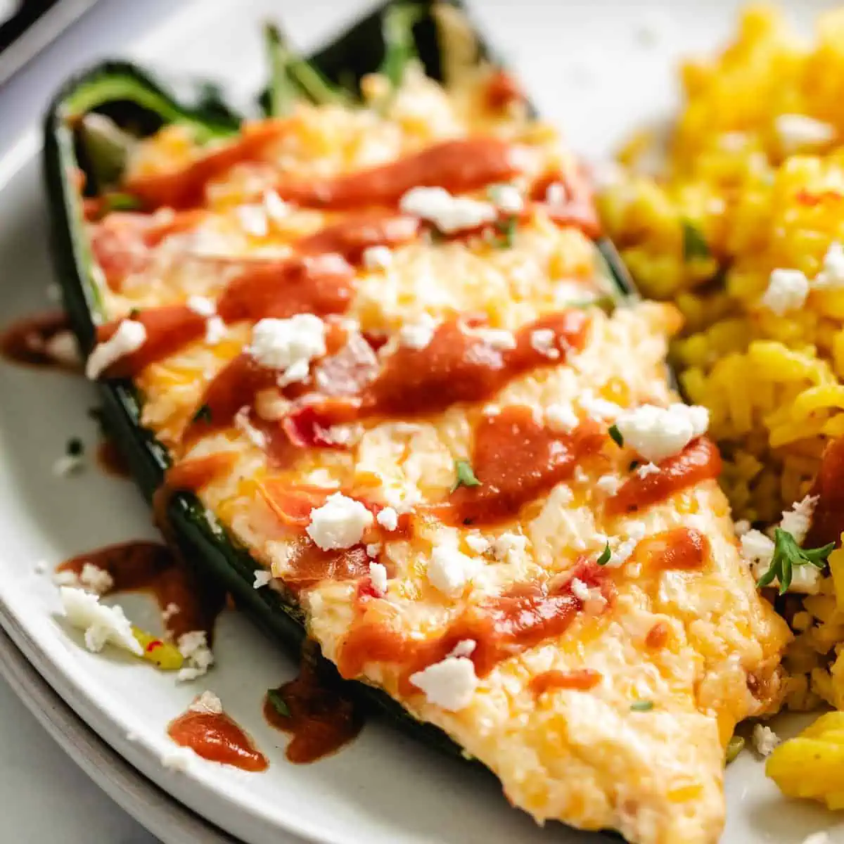 Crumble cheese over a cheesy poblano pepper.