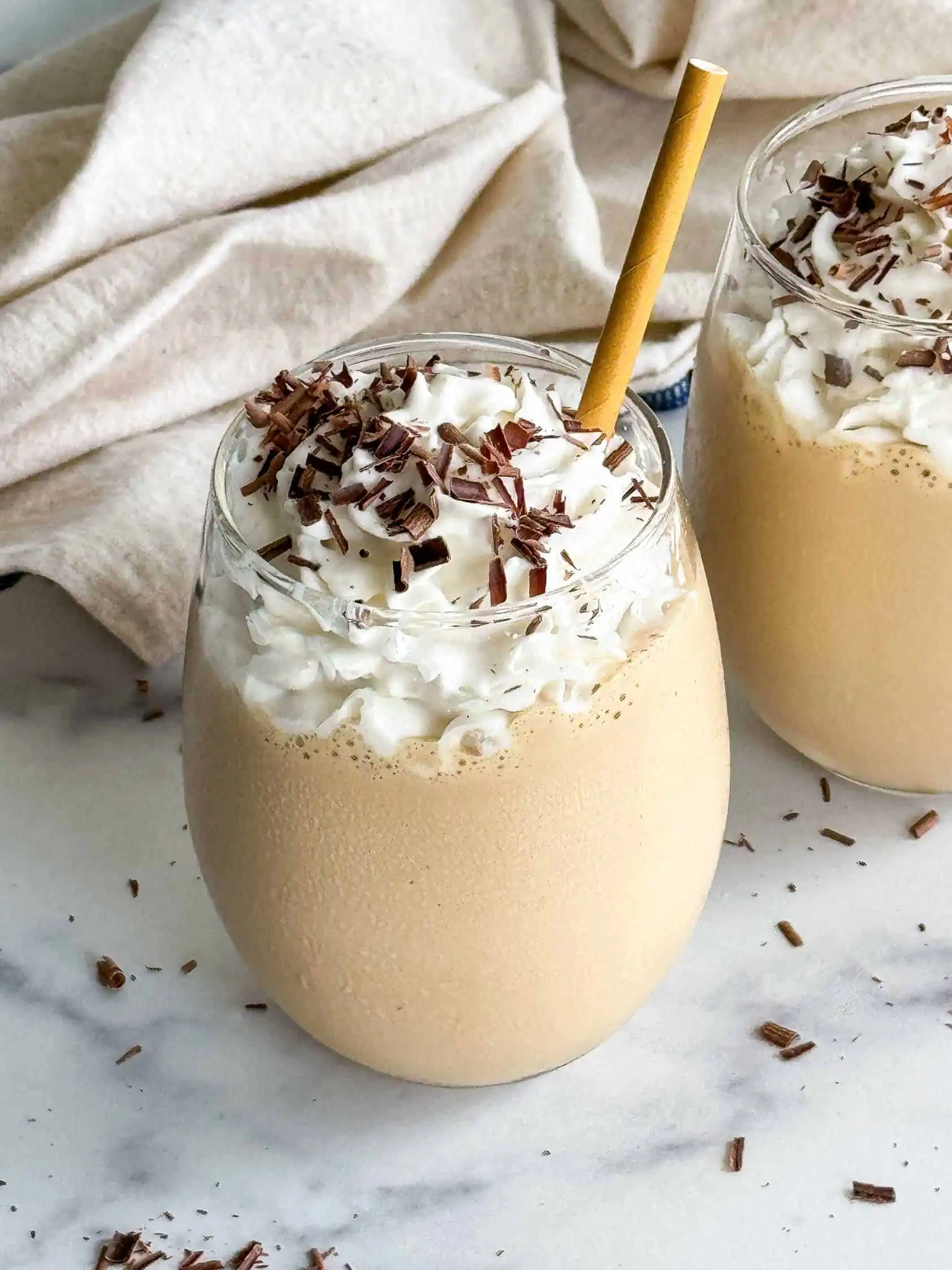 Brandy alexander coffee milkshake with a brown straw.