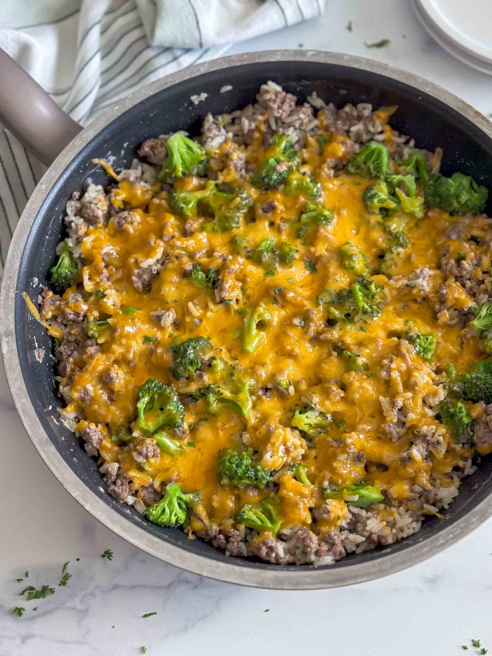 Skillet filled with cheesy ranch ground beef and rice.