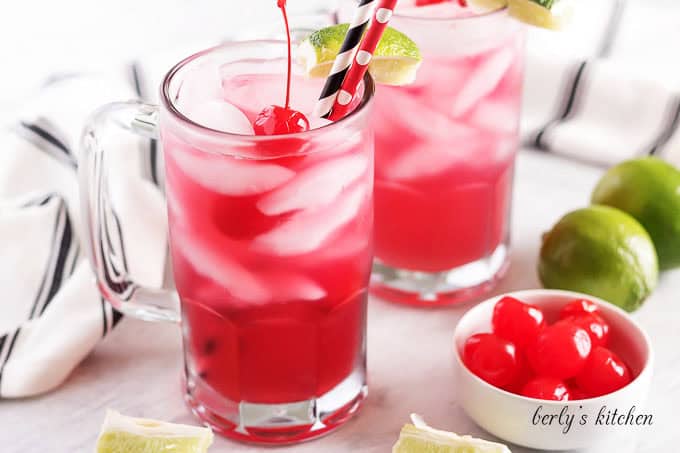 Cherry limeade in glass mugs.