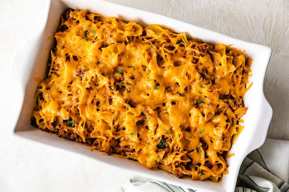 Cheesy beef and noodle casserole in a pan.