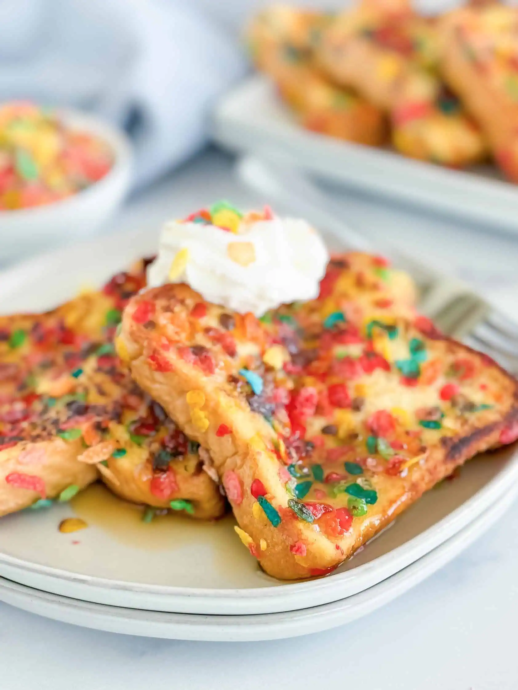 Fruity pebbles french toast on a plate.