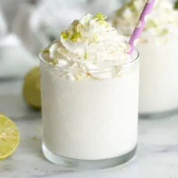 Blended key lime colada in glasses.