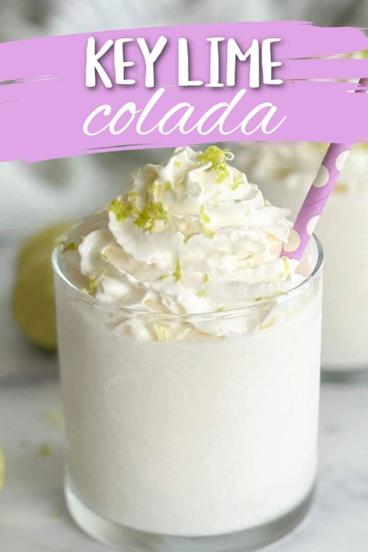 Whipped cream and lime zest on top of a key lime colada.