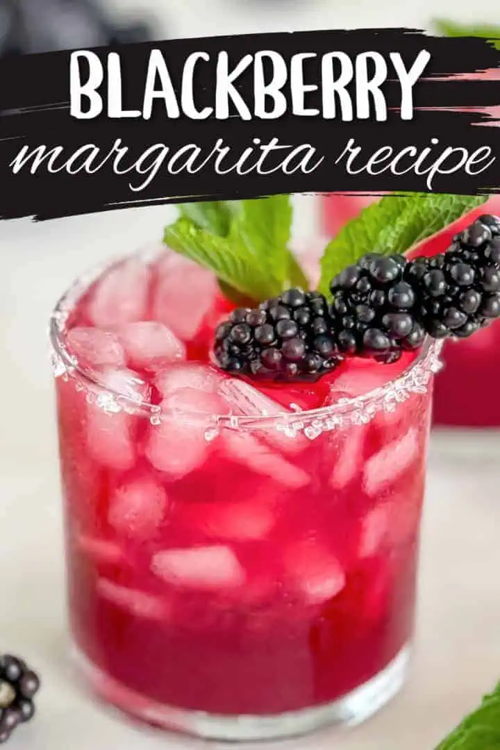 Pinterest pin image showing a blackberry margarita in a glass with a sugared rim, garnished with fresh blackberries and mint leaves, with the text "blackberry margarita recipe. "