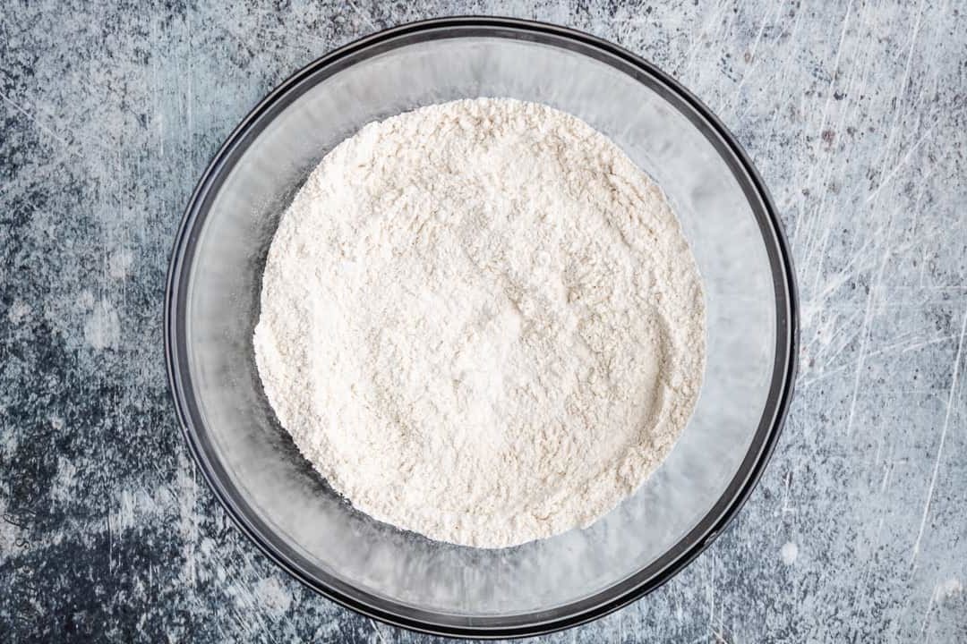 Flour, baking powder, and salt in a mixing bowl.