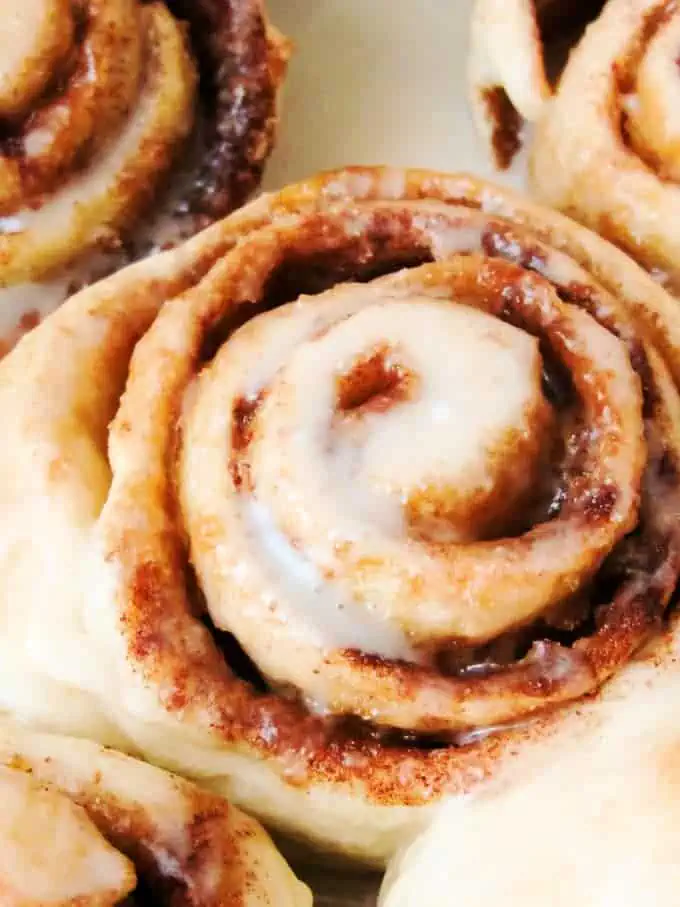 Top view of warm baked pastries with icing.