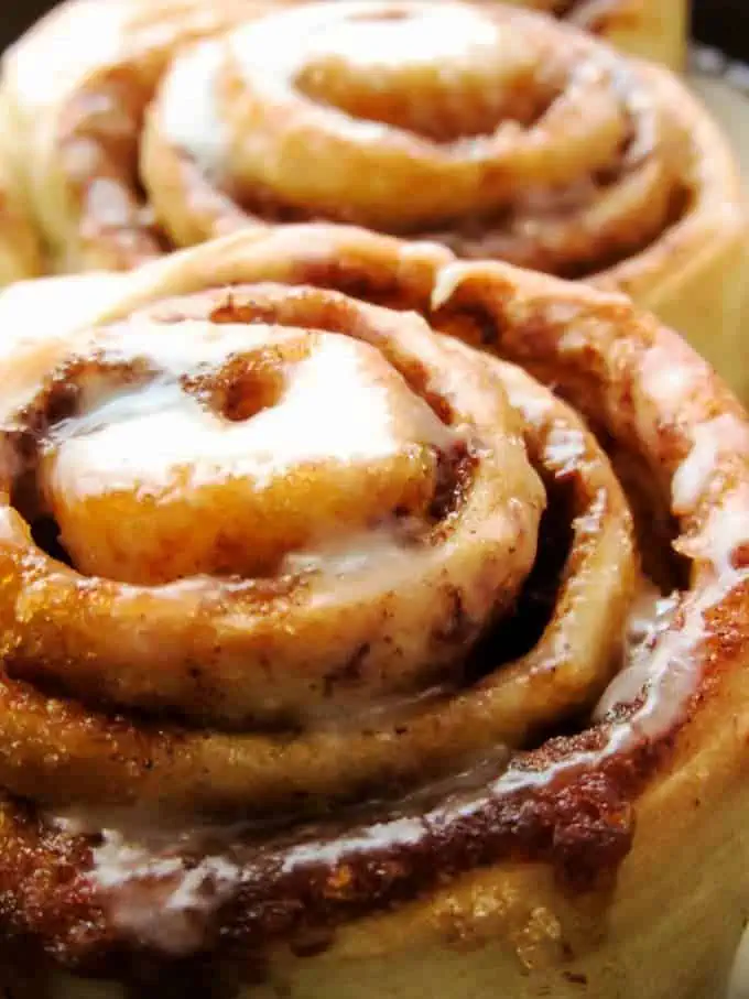 Warm pastries with icing starting to melt.