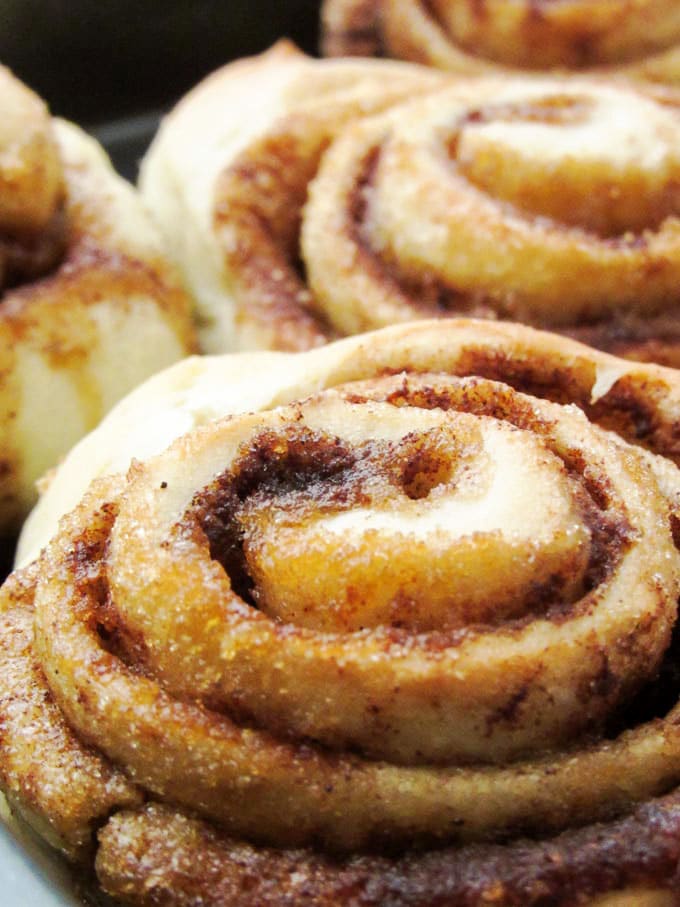 Freshly baked cinnamon rolls with a golden-brown color.
