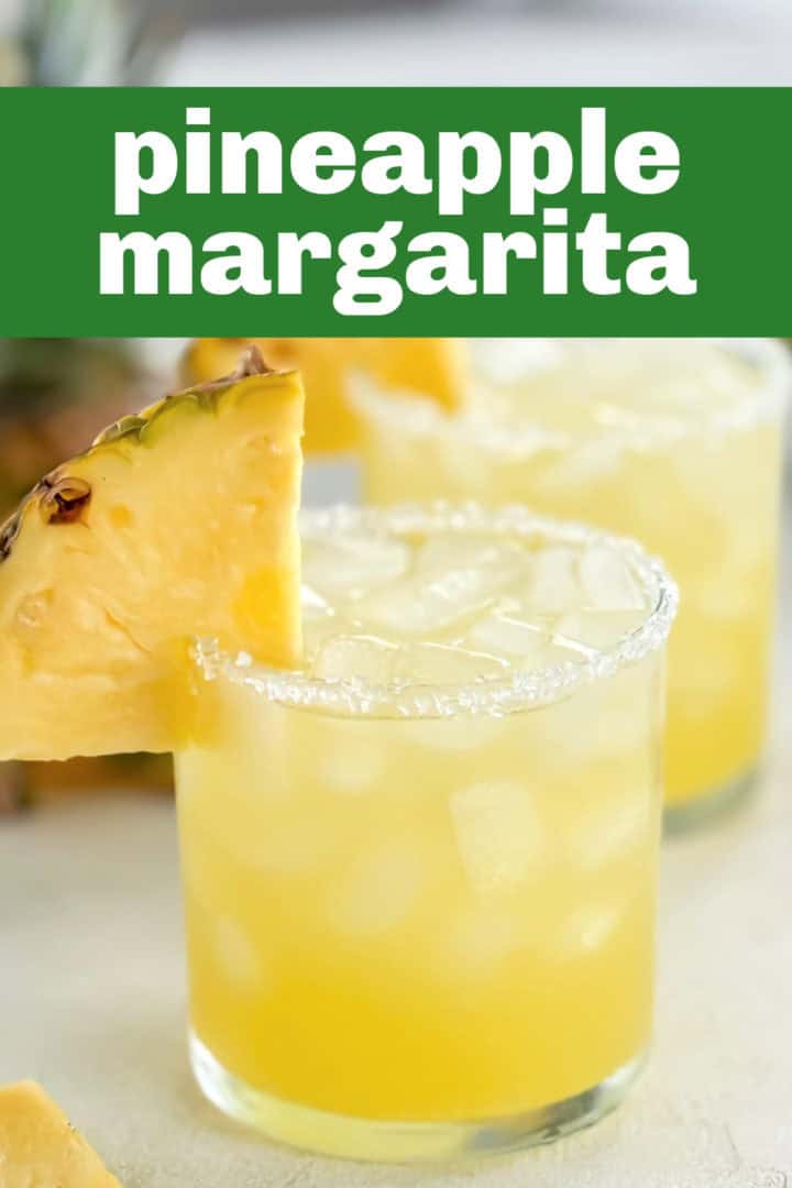 Delicious tropical drink garnished with pineapple, perfect for a summer refreshment.