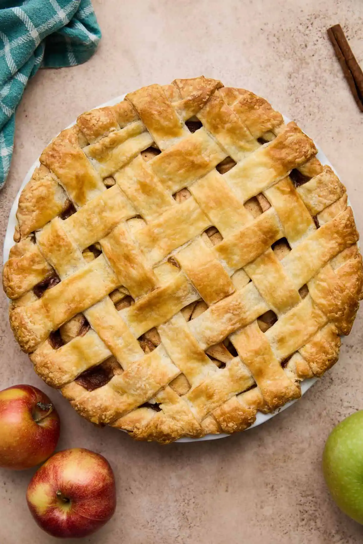 A close-up of the golden-brown lattice crust on a freshly baked pie.