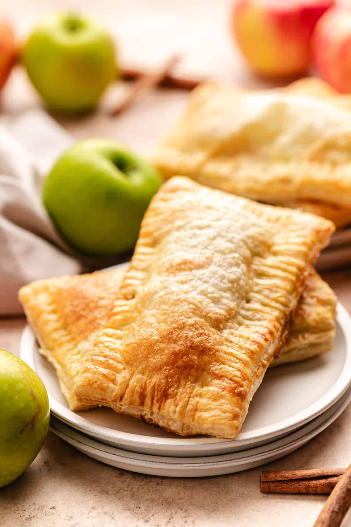 Freshly baked hand pies arranged on a plate.