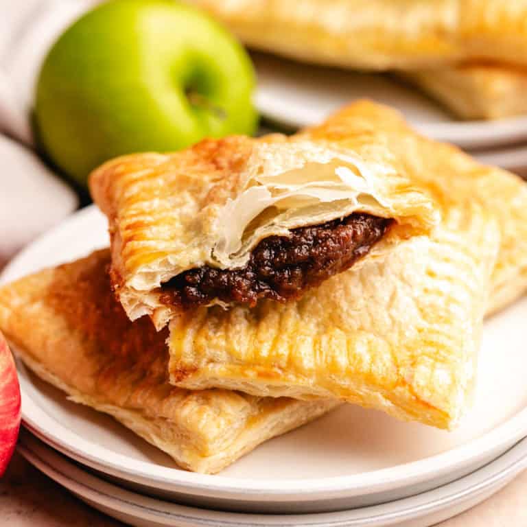 Golden puff pastry apple hand pies filled with sweet spiced apple butter.