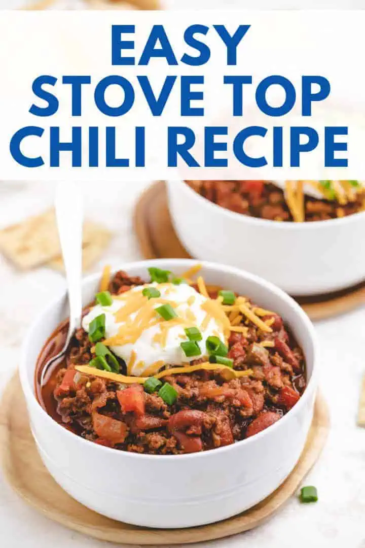 One pot chili recipe featuring ground beef, kidney beans, and diced tomatoes, topped with cheddar cheese and green onions, showing a flavorful blend of spices including cumin, chili powder, and smoked paprika.