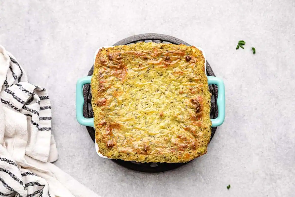 Baking dish filled with pesto dip.